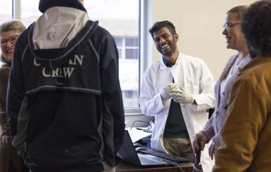 image of faculty and students at first friday events