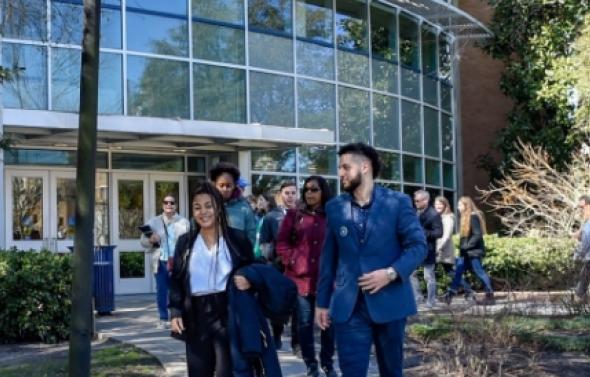 Group of ODU students walking outside of building