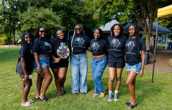 A group of girls pose for a photo. 