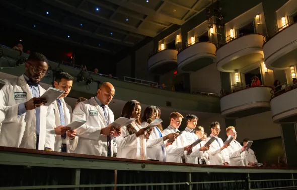 A group diverse EVMS students attend the 2022 White Coat cer