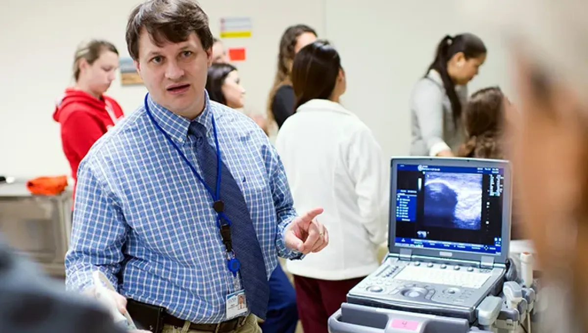 Dr. Craig Goodmurphy demonstrates ultrasound use to students
