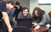 Students around a computer 