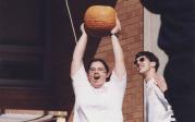 A member of the Society of Physics lifts an intact pumpkin that survived the fall during the 2000 Pumpkin Drop.