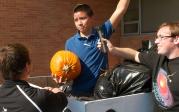 The 2011 winners of the Pumpkin Drop pose with their pristine pumpkin.