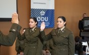 Two Army ROTC students are sworn in.