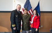 An Army ROTC student poses with his family.