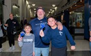 A man stands with two children inside ODU's basketball arena.