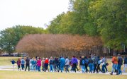  a group of students walk on ODU's campus.