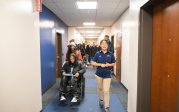 A group of students walk down a hallway in one of ODU's residence halls.