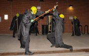 A group of people perform in costumes.