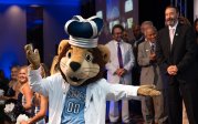 Photo of ODU's mascot dancing in front of a group of people.