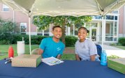 A pair of students sit at a table.