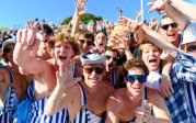 A group of people in the stands at a football game.