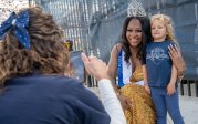 Dana Donegan poses with a child.