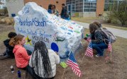 Students also place American flags around Dominion Rock as they pay tribute to Lt. Col. Brandon Shah (B.S. ’07) on Monday and Tuesday.