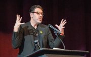 Gregory Grosvenor speaks at a podium.