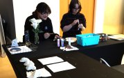 Two ODU students demonstrate how to construct medical dolls.