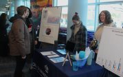 People standing near a booth