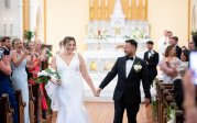 a couple walks down the aisle on their wedding day 