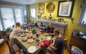 people sit around a table eating lunch 