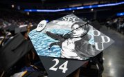 A graduation cap with decorated with anime art