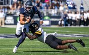Colton Joseph runs with the football.
