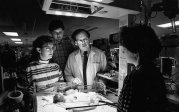 Doctor with patient, faculty and residents