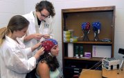 Student having sensors attached to their head.