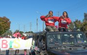 Two students ride in a car during ODU's homecoming parade.