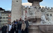 Group of students in front of Fountain of Neptune in Trento.
