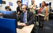 Faculty and students playing video games