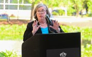 Cathy Lewis Emcee speaking at groundbreaking event.