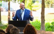 President Hemphill speaks at a podium.