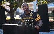 A student speaks at a podium.