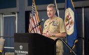 Adm. Samuel Paparo stands behind podium, speaking into a microphone as part of the Waldo Family Lecture Series on International Relations.