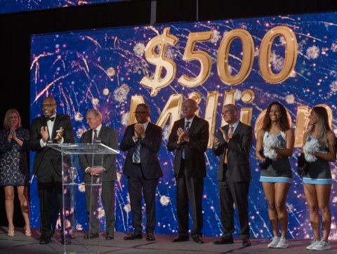 President Brian O. Hemphill, Ph.D., is joined on stage by alumni, staff and cheerleaders during the announcement of a five-year capital campaign at the Distinguished Alumni Honors Dinner and Campaign Celebration on Oct. 20.
