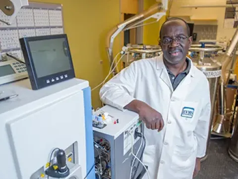 Dr. Julius Nyalwidhe poses in the laboratory.