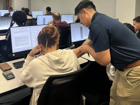 Student and professor at computer
