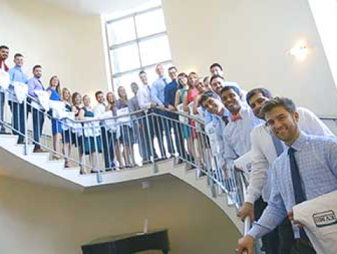 Medical students in white coats.