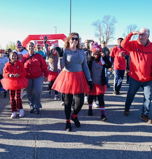 People walking across a finish line