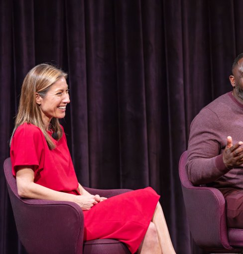 Two people sitting and talking