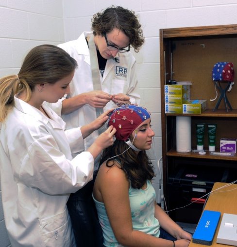 Student having sensors attached to their head.