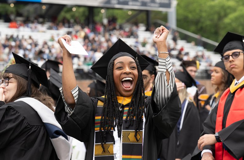 A graduate celebrates during Old Dominion University’s undergraduate Commencement exercise Saturday, May 4, 2024.