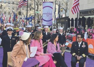 four women sit outside 