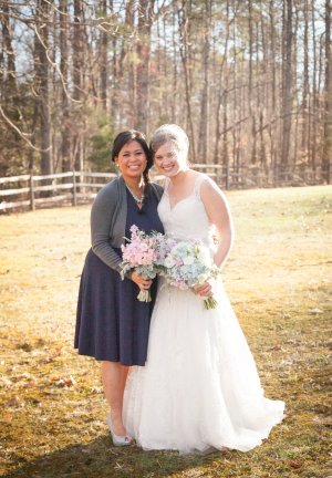 two women stand next to each other