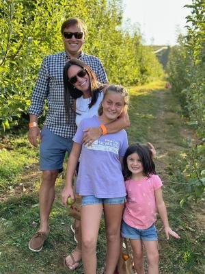 Alumnus, Kelly W. Brown poses with her husband and two daugh