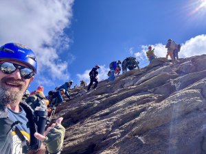 Group climbing a mountain