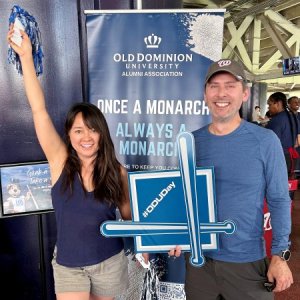 A woman and a man at a sporting event.