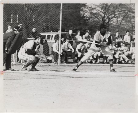 a man plays baseball