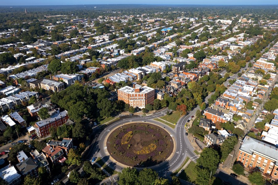 an overhead view of a garden circle and buildings 